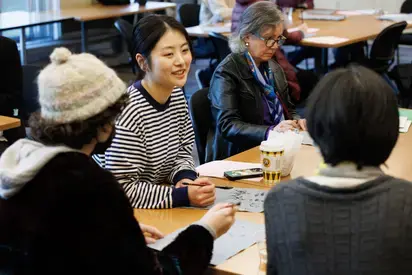 a group of students talking 