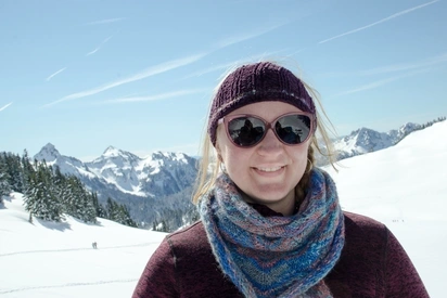 Cathy Flora smiling on a snowy mountainside 