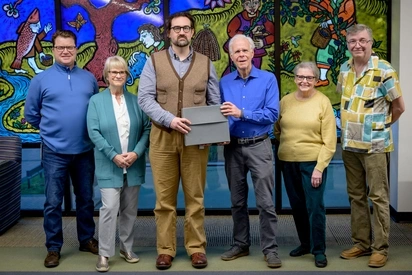 OHS and Evergreen College Archivist Grant Mandarino pose for a photo marking the occasion