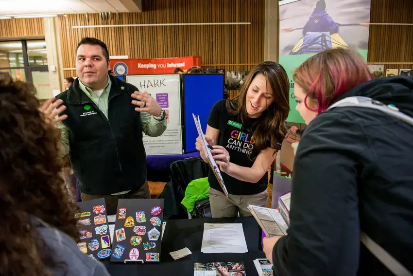 Students visit potential employers at a on campus job fair