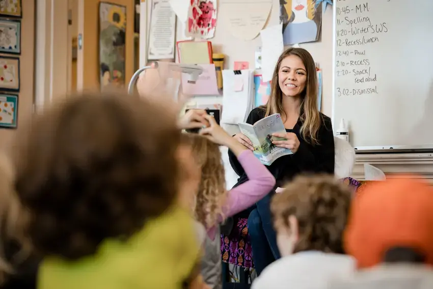 a student teacher reading to a class 