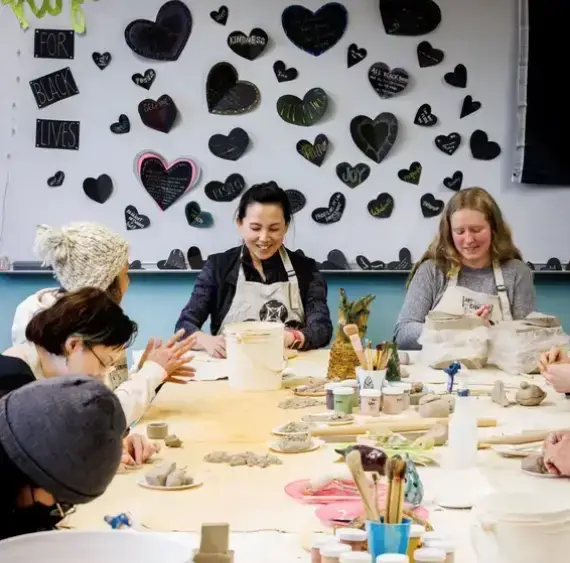 people in the social justice center crafting