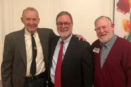 Photo of David Milne, Denny Heck, Oscar Soule, smiling and standing together.