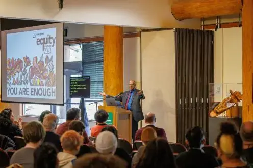EVP Dr. Dexter Gordon addresses the Evergreen community at the opening Plenary.