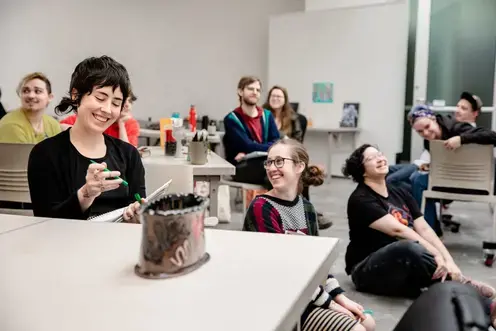 students in a classroom laughing 