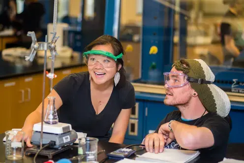 two students in the science lab